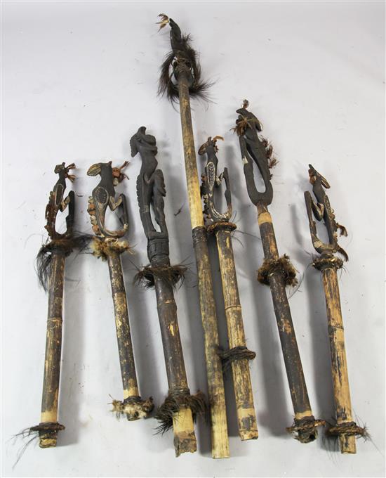 A collection of seven Sepik River tribal bamboo flutes